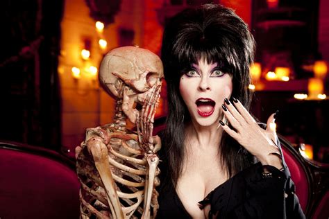 Elvira really is living her best life. In a new interview with CBS' Los Angeles affiliate KCAL 9, Cassandra Peterson — also known as the Queen of Halloween herself, Elvira, Mistress of the Dark — opened up even more about her relationship with T Wierson, the woman she's been with for 19 years.She even spilled some details on their adorable first kiss!